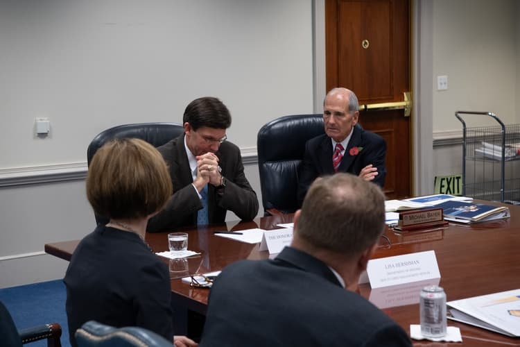 Federal contracting team reviewing documents for small business teaming and subcontracting support